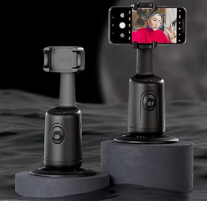 Black smartphone gimbal with smartphone displaying a person in a red shirt on a dark background
