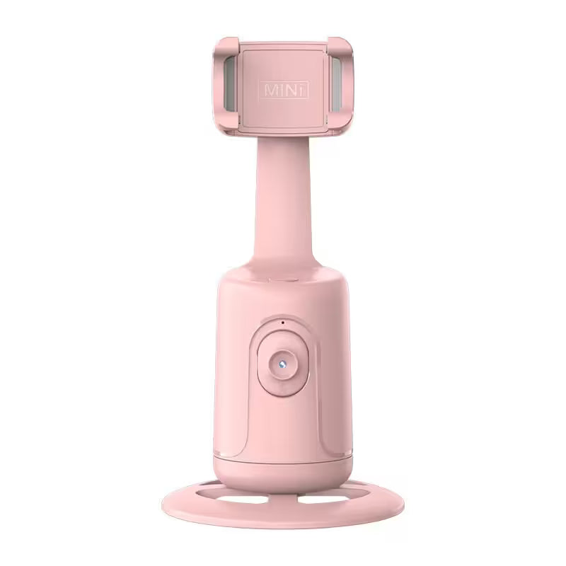 Pink handheld device with a suction cup on a white background
