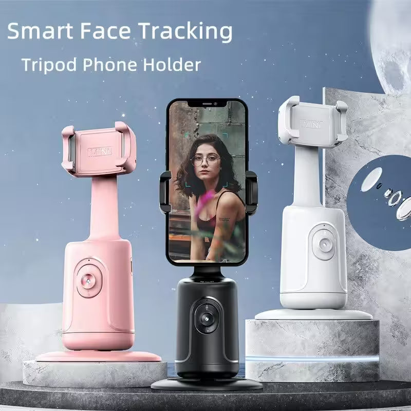 Smart face tracking tripod phone holder with pink, black, and white models on a gray platform.