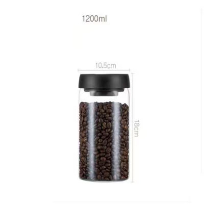 Glass jar with black lid containing coffee beans, showing measurements on a white background.