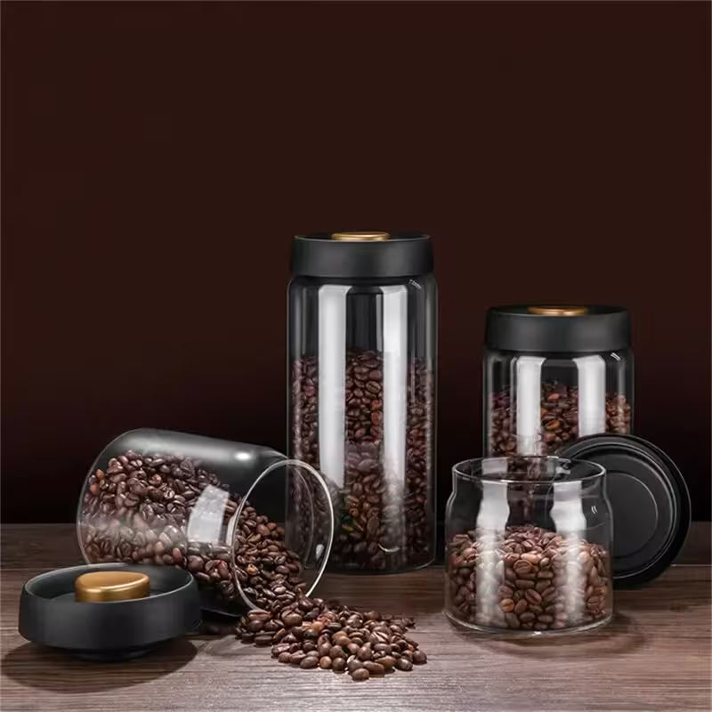 Set of glass jars with coffee beans on a wooden surface