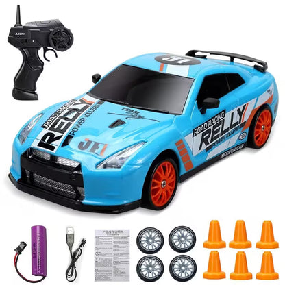 Toy race car with remote control, battery, and accessories on a white background