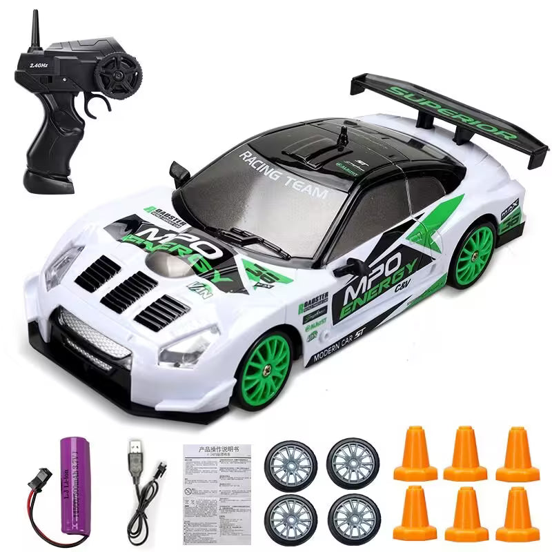 Toy racing car with remote control, wheels, and cones on a white background