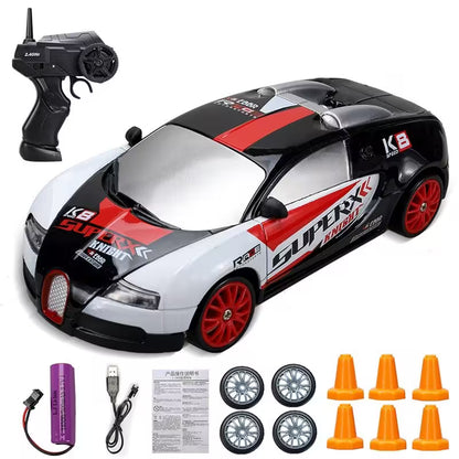 Toy race car with remote control, battery, and accessories on a white background