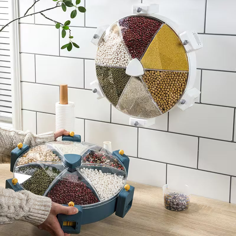 Spinning wheel with compartments filled with various seeds on a kitchen counter.