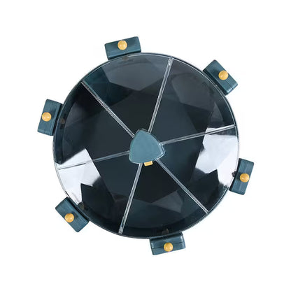 Round black object with metallic accents on a white background