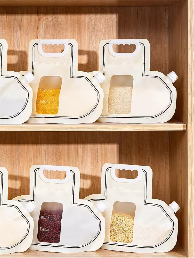 White ceramic containers with handles on a wooden shelf