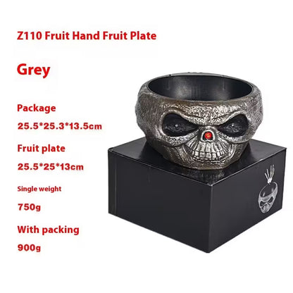 Skull-shaped fruit plate on a black stand with product details in red text.