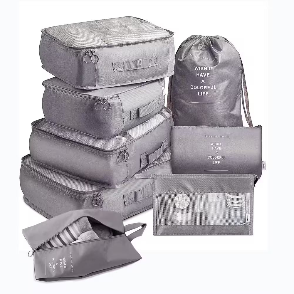 Set of gray packing cubes and bags with text on a white background
