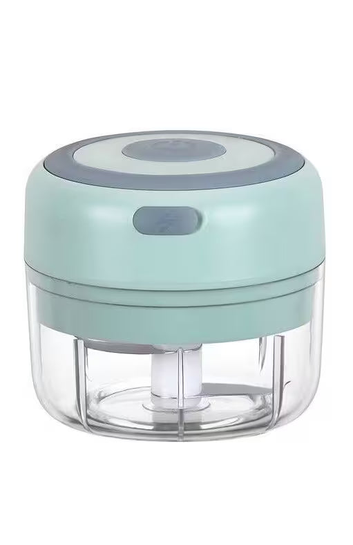 Small kitchen chopper with a light blue top and clear base on a white background