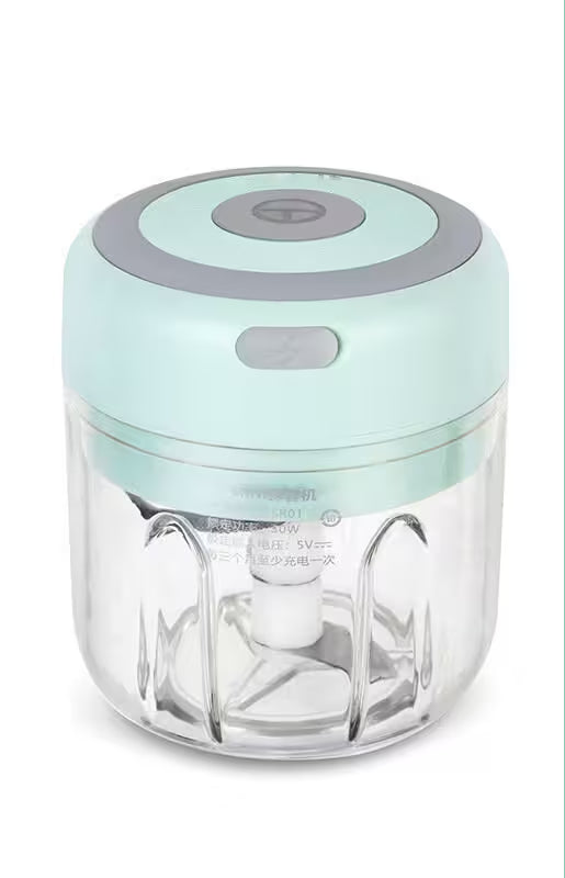 Small kitchen appliance with a clear container and light blue lid on a white background