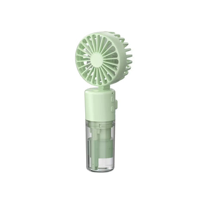 Green handheld fan on a white background