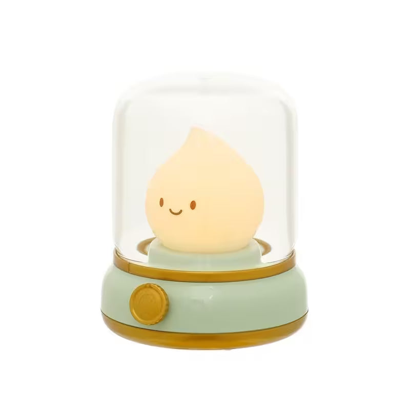 Cute lamp shaped like a teardrop with a smiling face inside a transparent dome on a white background