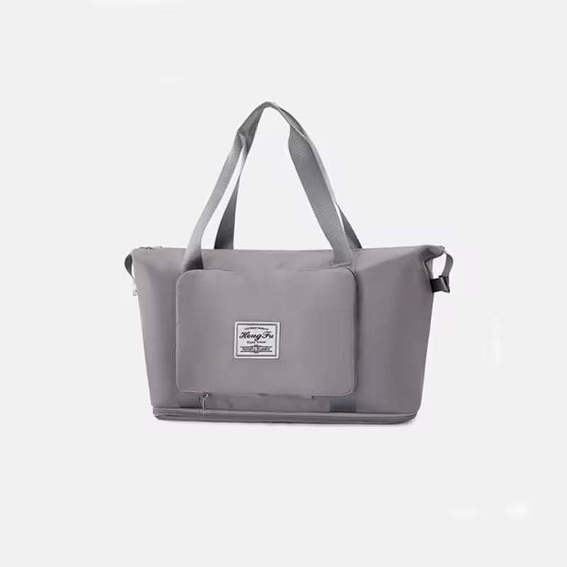 Gray tote bag with a visible brand label on a light gray background