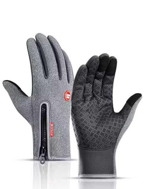 Pair of gray and black gloves with a zipper on a white background
