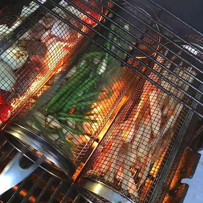 Close-up of a grill basket with vegetables being cooked over an open flame.