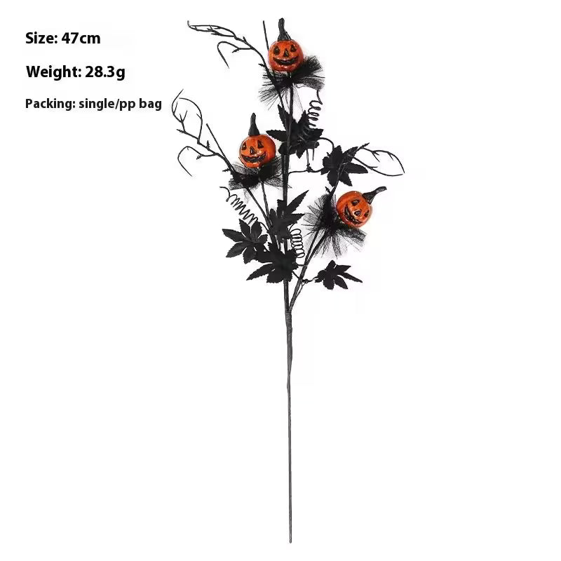 Halloween decorative stem with pumpkins and black leaves on a white background