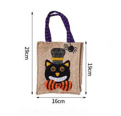 Halloween-themed bag with a black cat design, spider, and plaid handle, shown with measurements on a white background.