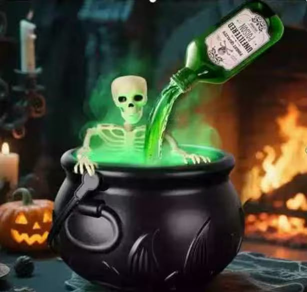 Halloween-themed decoration with a skeleton in a cauldron and a bottle pouring green liquid.