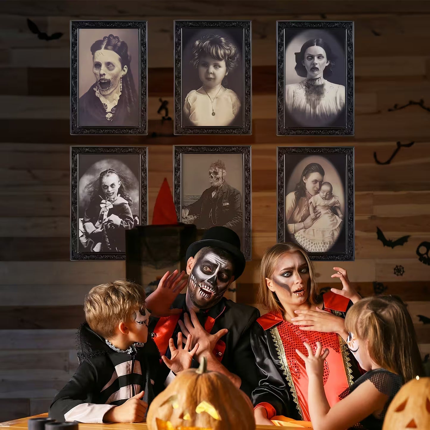 People in Halloween costumes with vintage portraits on a wooden wall.
