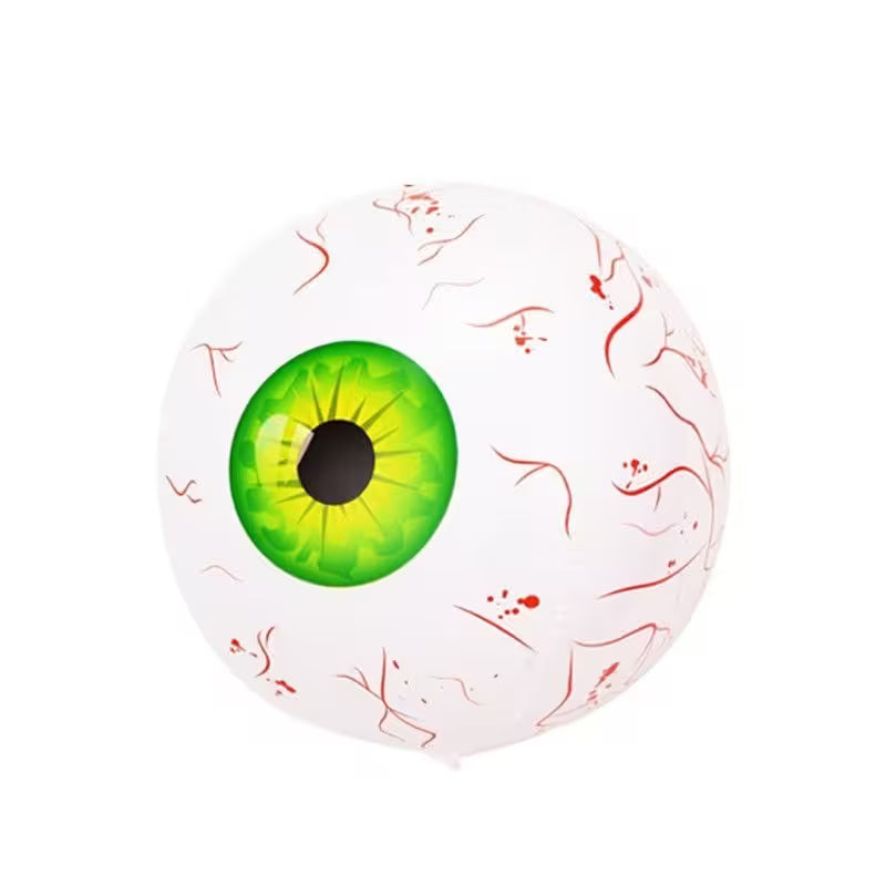 Toy eyeball with green iris and red veins on a white background