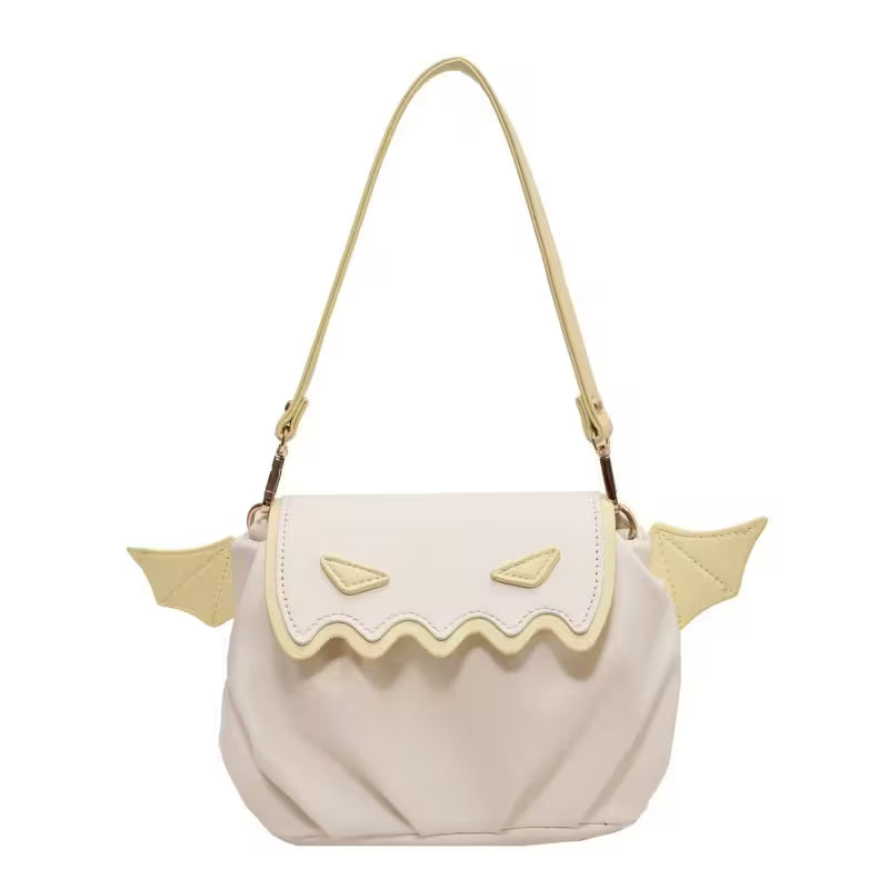 Beige handbag with yellow accents on a white background