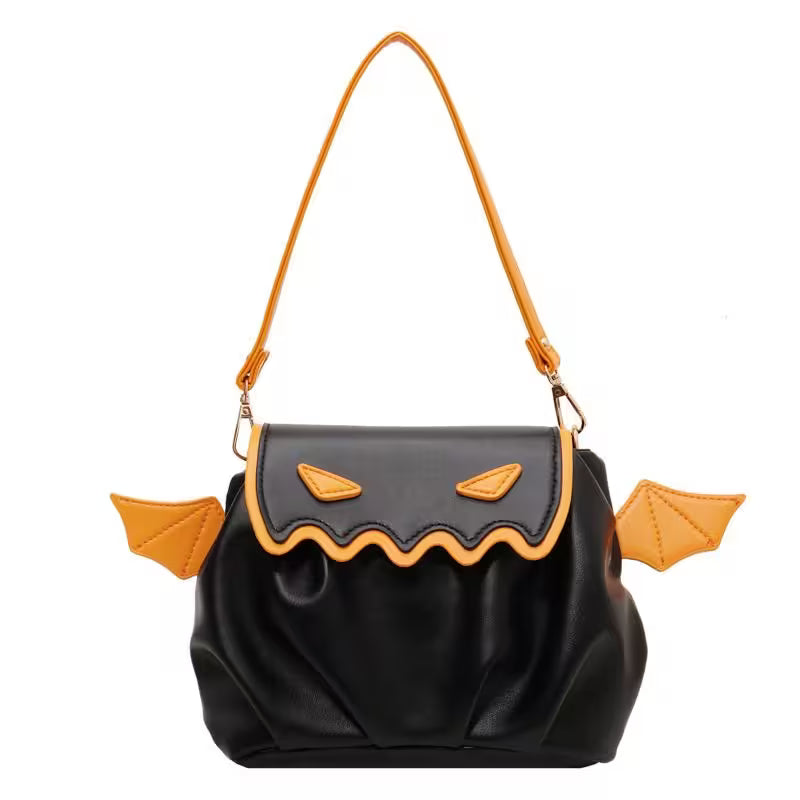 Black bag with orange accents resembling a jack-o'-lantern face on a white background