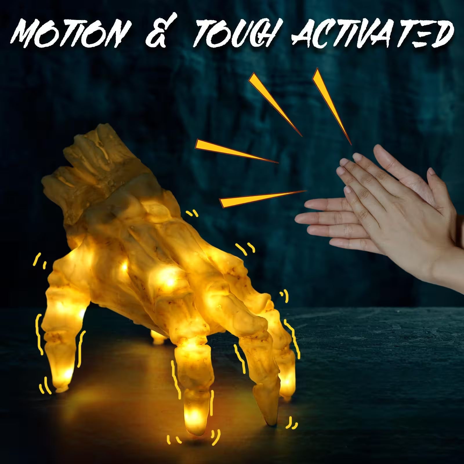 Light-up dog paw with glowing yellow lights on a dark background, activated by a hand clapping.
