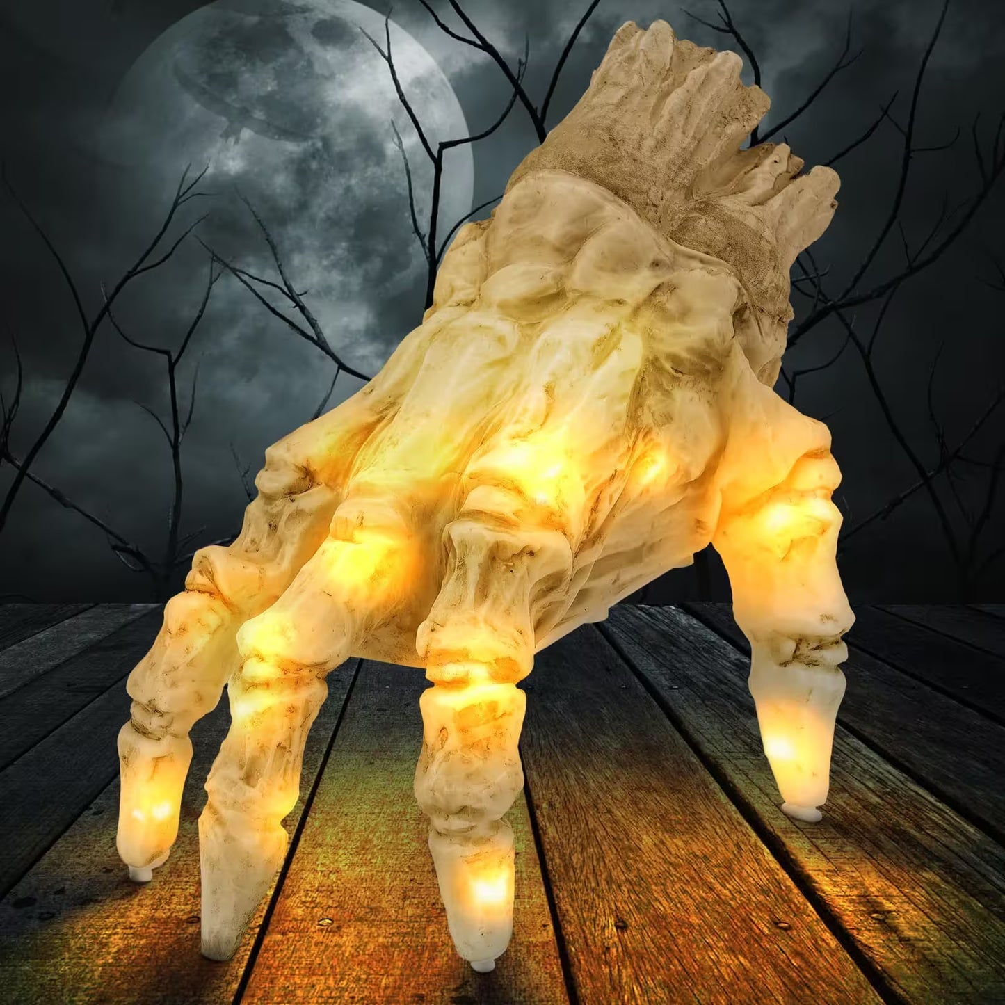 Light-up creature with glowing eyes on a wooden platform against a dark, moonlit sky.