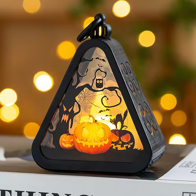 Halloween-themed decorative light with pumpkins and ghosts on a blurred background