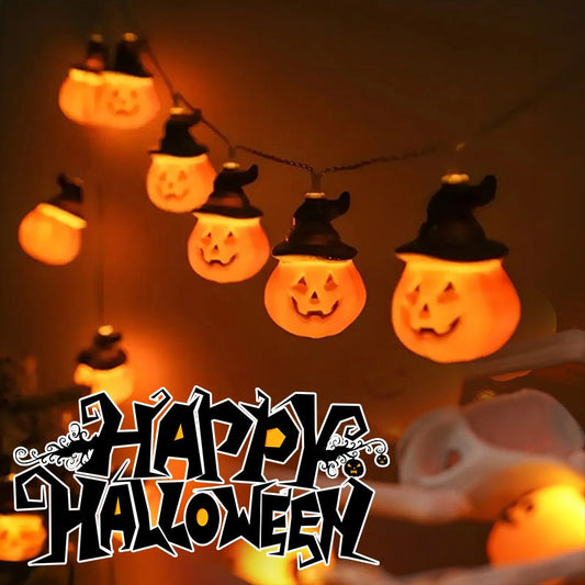 String lights shaped like jack-o'-lanterns with a 'Happy Halloween' text overlay.