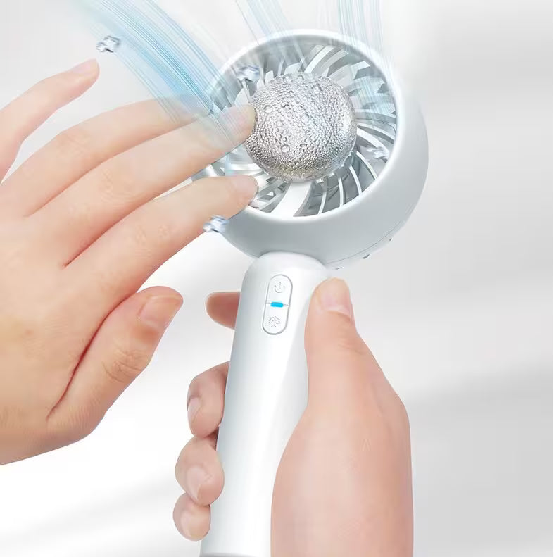Handheld fan with a hand holding it on a white background