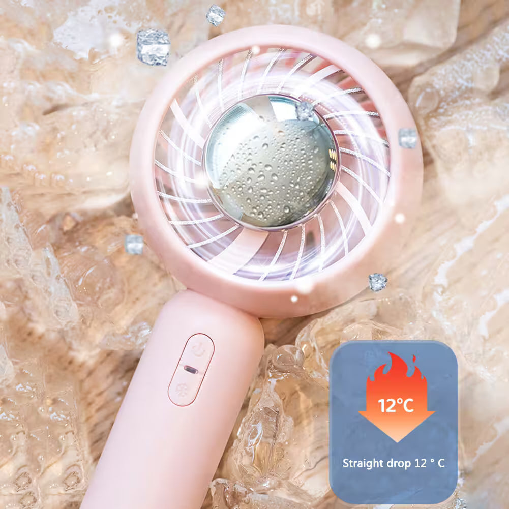 Pink handheld fan with water droplets on a textured beige background