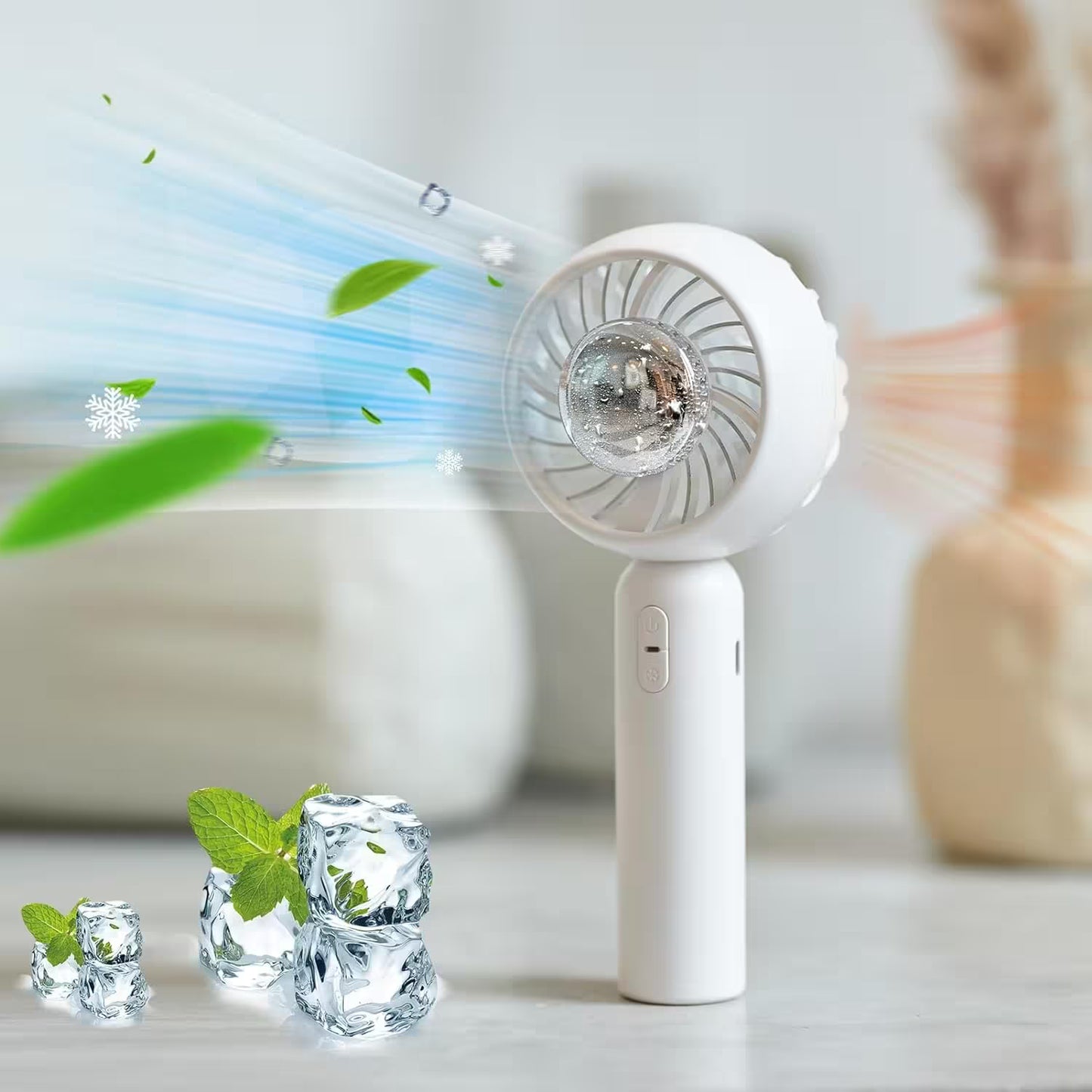 Handheld fan with ice cubes and mint leaves on a light background