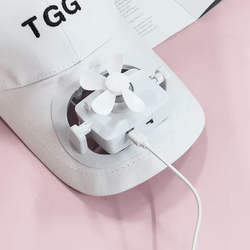 White electronic device with a cable on a pink background