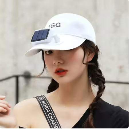 Person wearing a white cap with a solar panel and 'GG' logo, against a blurred background.