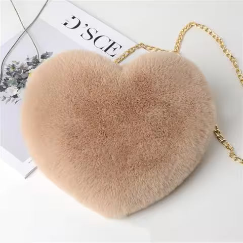 Heart-shaped fluffy bag with a gold chain on a white background