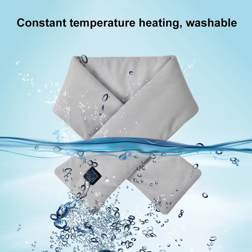 Gray heating pad with water splashes on a light blue background, labeled 'Constant temperature heating, washable'.