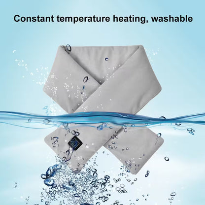 Gray heating pad with water splashes on a light blue background, labeled 'Constant temperature heating, washable'.