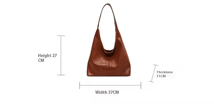 Brown leather handbag with measurements on a white background