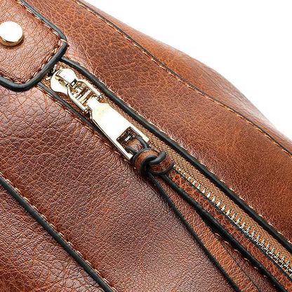 Close-up of a brown leather bag with a gold zipper and brand logo.
