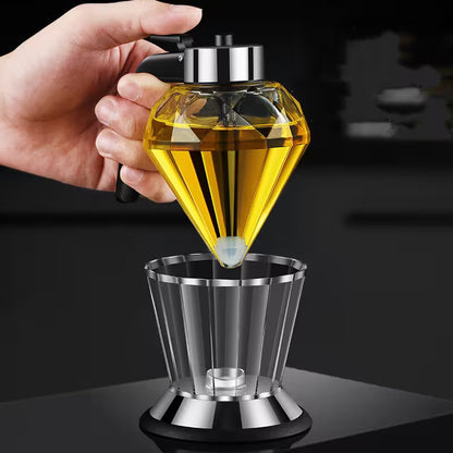 Hand holding a diamond-shaped oil burner with a dark background
