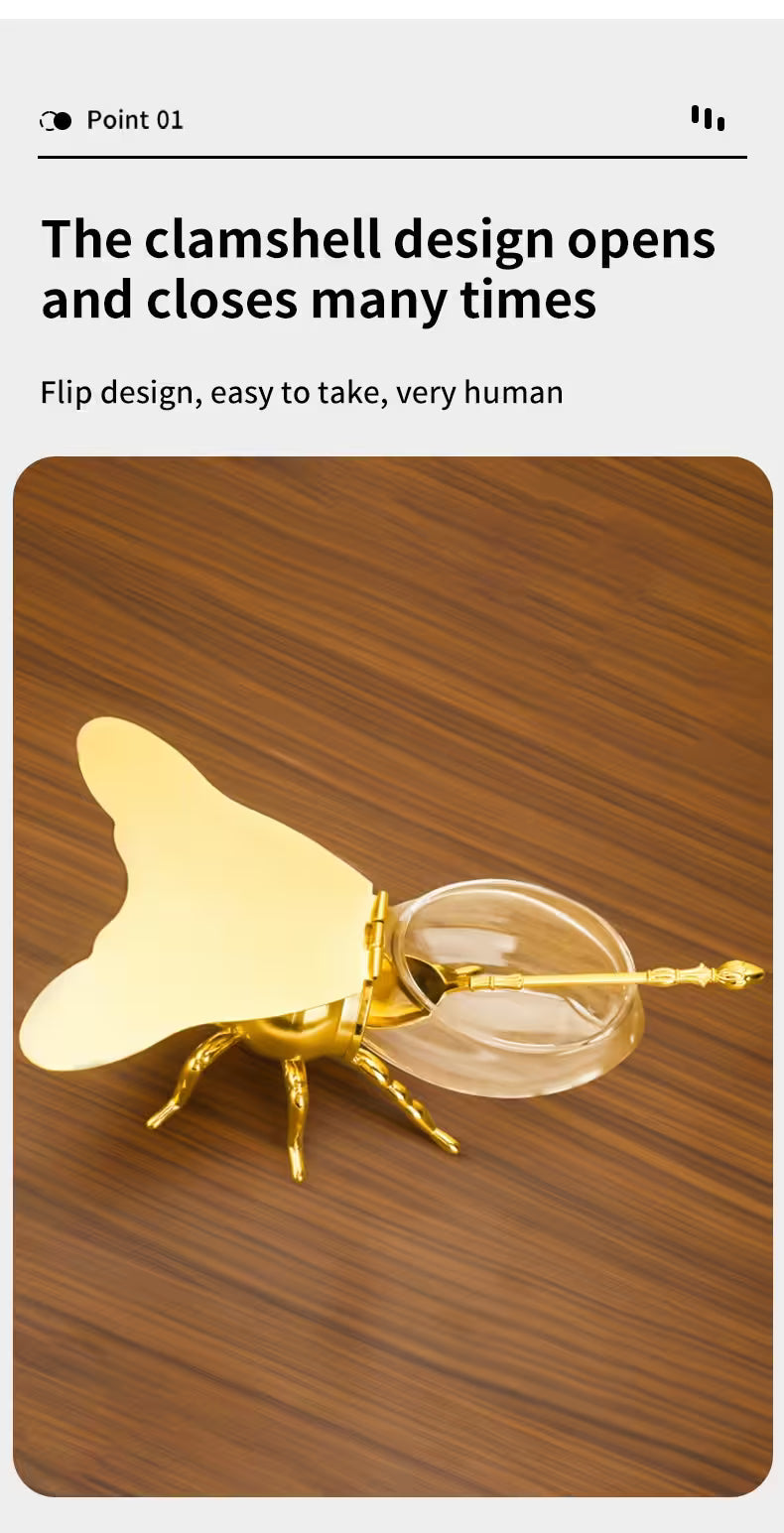 Gold earring with clamshell design on a wooden background