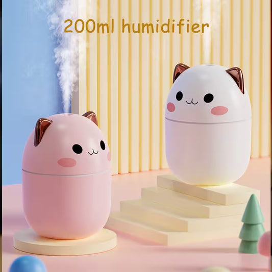 Two cute cat-shaped humidifiers on a pastel background with text indicating capacity.