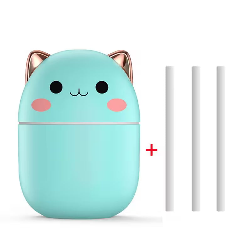 Mint green cat-shaped container with rose gold accents and two white sticks on a white background