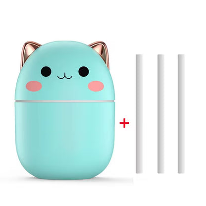 Mint green cat-shaped container with rose gold accents and two white sticks on a white background