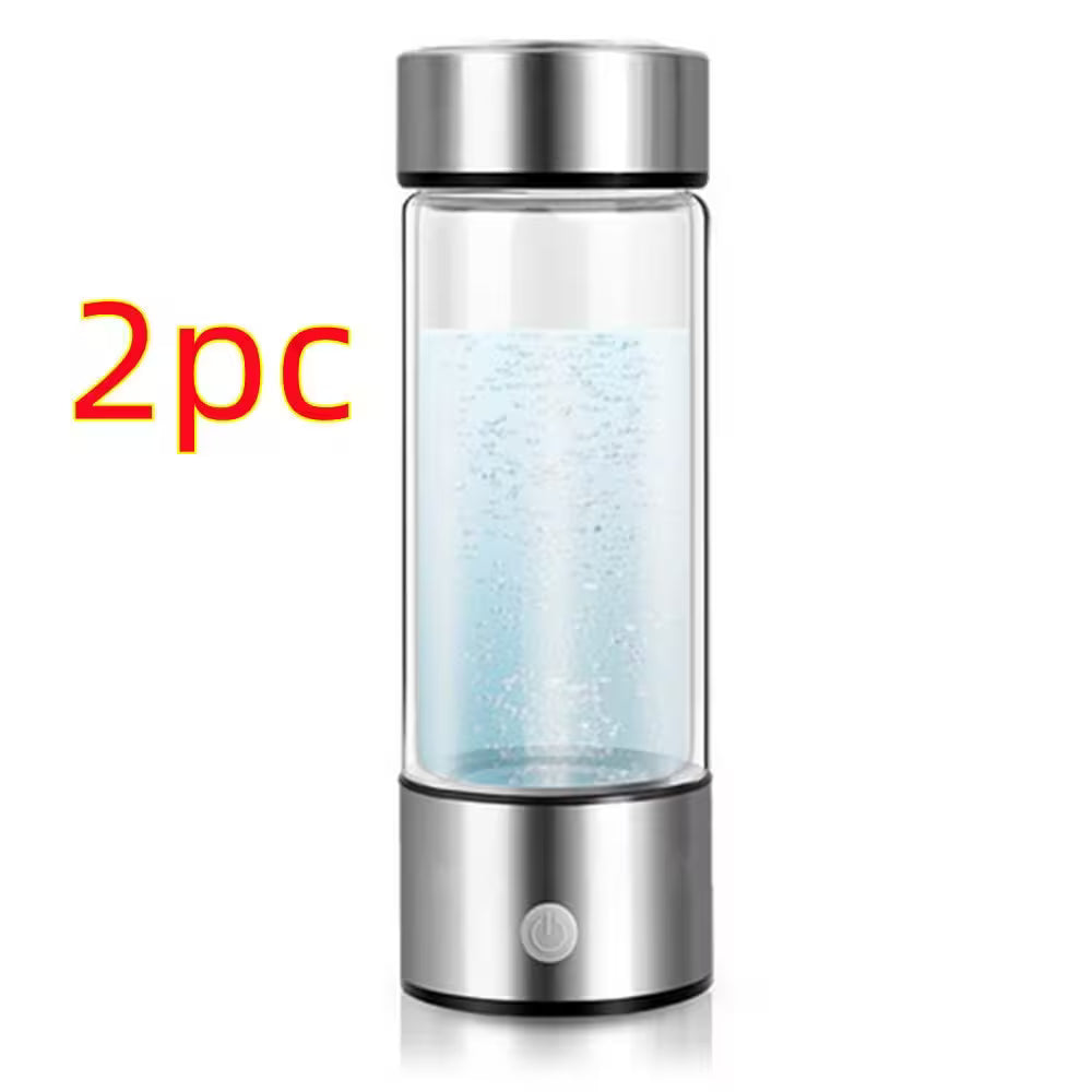 Glass water bottle with silver lid and base on a white background, labeled '2pc'.