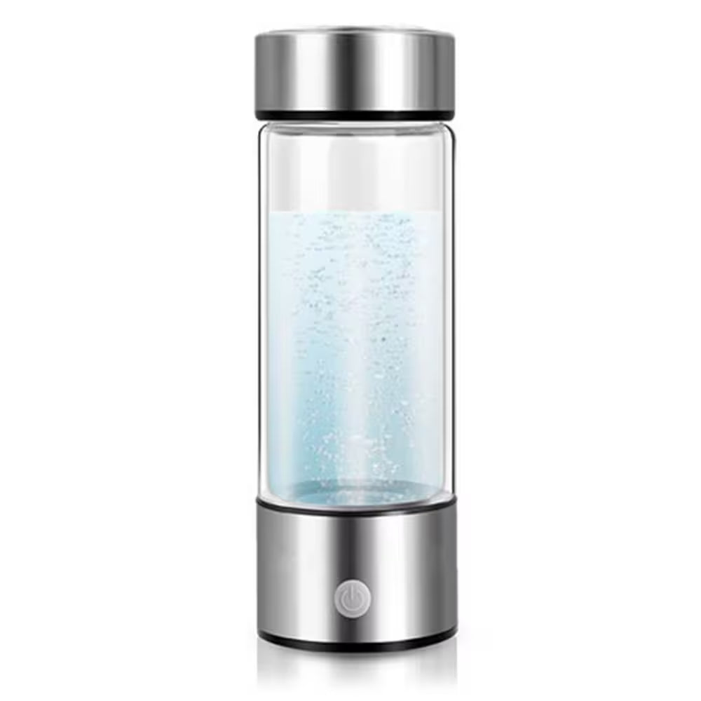 Glass water bottle with silver base and lid on a white background