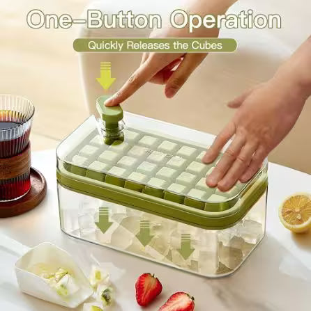Green ice cube tray with one-button operation feature, shown on a kitchen counter.