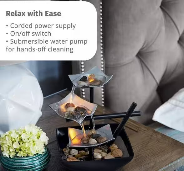 Decorative water feature on a table with text about its features.